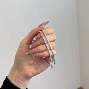 Macro detail of S925 sterling silver tennis bracelet with sparkling 3mm cubic zirconia stones
