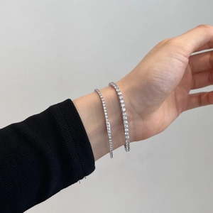 Close-up of S925 silver tennis bracelets with white zircon inlays on woman wrist