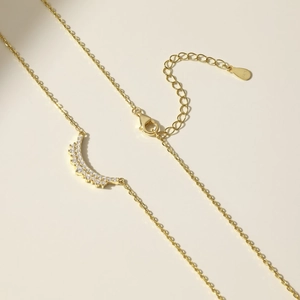 Detailed macro view of S925 sterling silver lobster clasp and adjustable extender chain