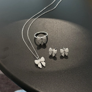 Close-up of S925 sterling silver butterfly jewelry set with zircon necklace and earrings