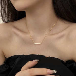 Minimalist S925 sterling silver bar necklace with cubic zirconia worn by a model