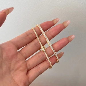 Close-up of gold plated S925 sterling silver tennis bracelets with cubic zirconia stones
