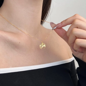 Elegant gold S925 sterling silver necklace featuring a hollow world map globe pendant