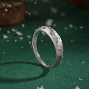 Macro detail of S925 silver star ring with matte finish and sparkling zircon stones