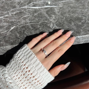 Detail of S925 silver ring featuring a pear-cut zircon and matte textured finish
