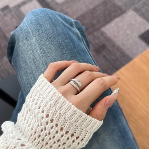 Detailed view of an S925 sterling silver snake-style ring with shimmering micro-pave diamonds