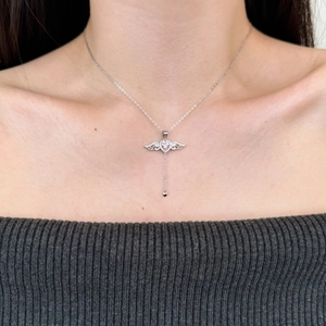 S925 sterling silver angel wing necklace with pink heart pendant and chain tassel on model
