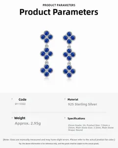Close-up of S925 silver dangling earrings featuring blue cubic zirconia floral design