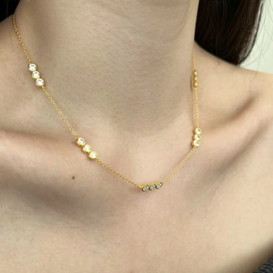 Close-up of S925 silver necklace with sparkling zircon stones worn on neck