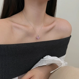 Close-up of S925 sterling silver necklace featuring a pink heart-shaped crystal pendant