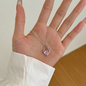 Detail of S925 sterling silver necklace with pink heart-shaped cubic zirconia pendant