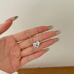 Elegant S925 sterling silver necklace with heart-shaped diamond-encrusted pendant charm