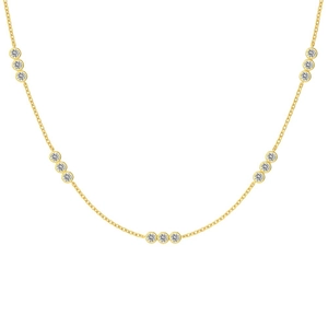 Elegant gold station necklace with sparkling zircon clusters on a delicate chain
