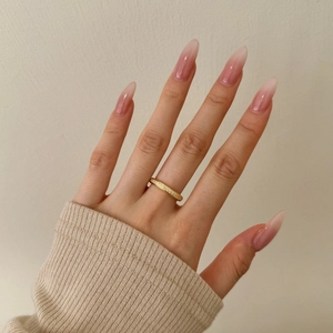 Close-up of gold-plated S925 silver eternity ring with zircon inlay on model's hand