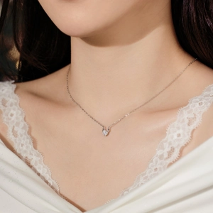 Close-up of S925 sterling silver reindeer antler necklace with a sparkling cubic zirconia