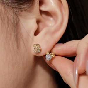 Macro shot of S925 silver Christmas elk antler and gift box earrings set for women
