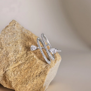 Detailed close-up of a multi-layer silver spiral ring with pear-cut cubic zirconia stones