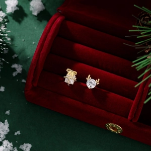 Detail of S925 silver Christmas earrings with gift box and golden elk antler design