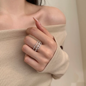 Close-up of three stacked S925 silver rings with marquise-cut zircon stones on a model