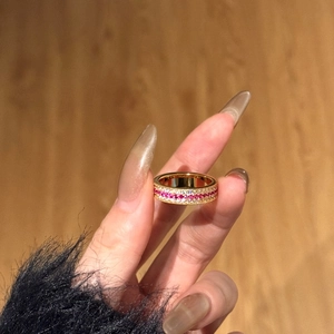 Eternity band in gold plating with triple row pavé-set red and white zircon stones