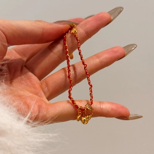 Elegant red cord silver bracelet with gold gourd pendant and crystal ring charms