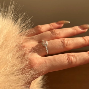 Macro view of S925 sterling silver ring featuring a pink square gem and halo diamonds