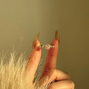Detailed close-up of a square-cut pink gemstone ring with halo diamond setting in S925 silver