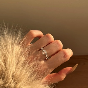 Close-up of S925 silver ring featuring heart-shaped pink zircon and micro-set diamonds