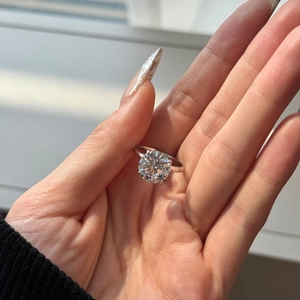 Macro shot of S925 sterling silver ring featuring a sparkling four-prong round zircon