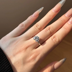 Detailed view of an elegant S925 sterling silver ring with a classic six-prong setting solitaire