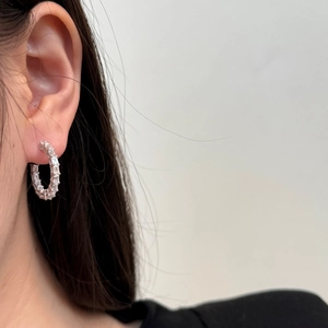 Sparkling S925 sterling silver hoop earrings featuring baguette-cut cubic zirconia stones