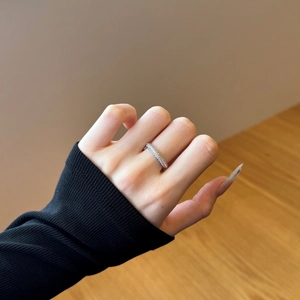 Close-up of a double-layer S925 sterling silver ring with sparkling pavé zircon stones