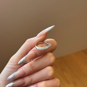 Elegant S925 sterling silver double row pavé ring worn on finger with sparkling crystals