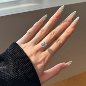 Close-up of S925 silver solitaire ring with four-prong set round cubic zirconia on hand