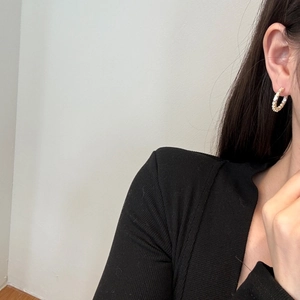 Detailed close-up of S925 silver hoop earrings with gold plating and rectangular zircons