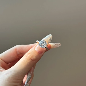 Macro view of a classic six-prong setting with a sparkling round-cut cubic zirconia stone