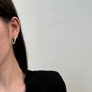 Detailed view of S925 silver C-shape earrings with inlaid rectangular zircons on model