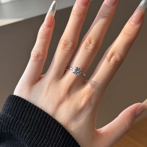 Close-up of S925 silver ring featuring a four-prong set round solitaire cubic zirconia