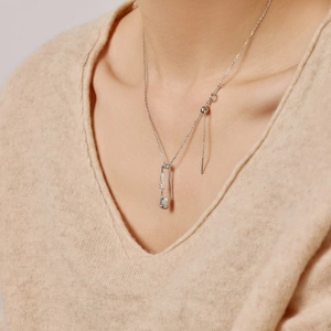 Detail of S925 silver safety pin necklace with heart zircon and Mom engraving