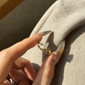 Detailed view of a marquise cut diamond ring on S925 sterling silver golden band
