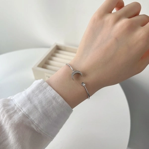 S925 sterling silver moon and heart open bracelet worn on wrist for daily fashion