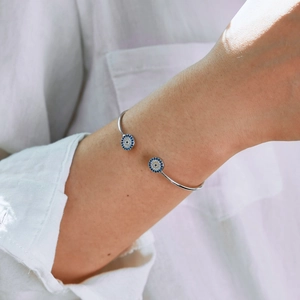 Detail view of S925 sterling silver cuff bracelet with evil eye blue zircon accents
