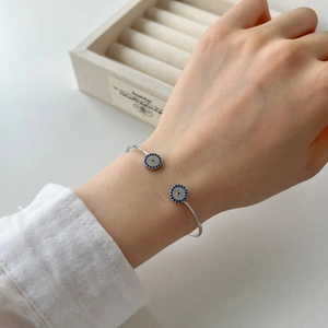 Elegant S925 sterling silver open bangle with blue evil eye charms and pave zircons