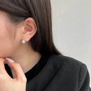 Elegant S925 sterling silver flower stud earrings featuring sparkling zircon on a model