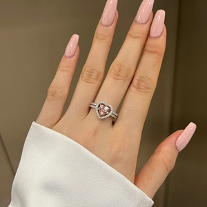 Close-up of S925 sterling silver ring with heart-shaped pink zircon and micro-set crystals