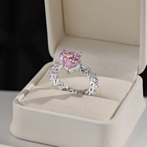 Detail view of pink heart-cut zircon ring with S925 hallmark on polished silver band