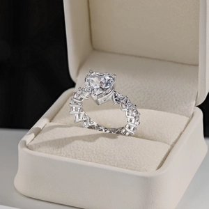 Macro shot of S925 hallmark on silver ring band with heart-cut zircon in gift box