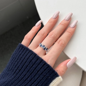 Exquisite S925 sterling silver ring with blue zircons and wavy pave setting design