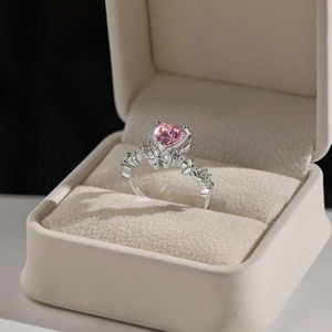 Macro shot of S925 silver ring featuring a heart-shaped pink stone and diamond accents