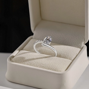 Macro shot of S925 sterling silver ring with oval cubic zirconia and crisscross band